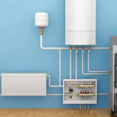 System grzewczy z kotłem, zasobnikiem, grzejnikiem i rozdzielaczem. Widoczny zawór ATV, kluczowy dla zasady działania systemu.