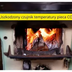 Piec CO z płonącym żarem, nad którym widnieje napis "Uszkodzony czujnik temperatury pieca CO".